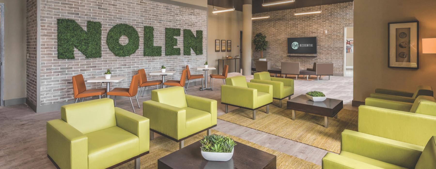 a room with green couches and a coffee table