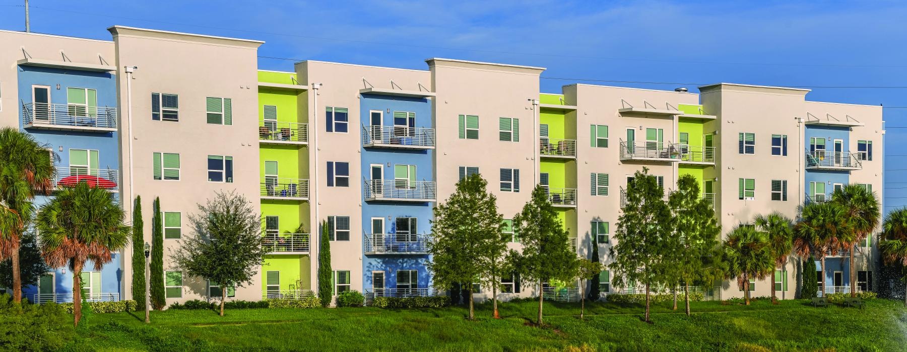 a row of buildings next to a body of water